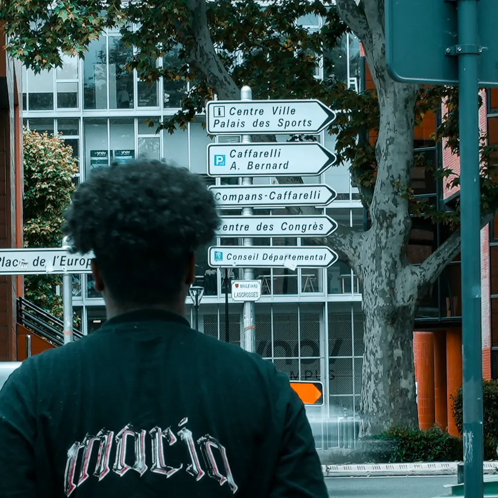 Street direction signs pointing several ways in Toulouse, France